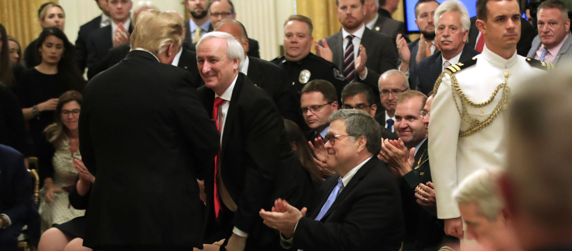 President Donald Trump greets Attorney General William Barr, seated, Deputy Attorney General Jeffrey Rosen, and invited guests during a ceremony awarding the Public Safety Officer Medal of Valor in the East Room of the White House in Washington, Wednesday, May 22, 2019 President Donald Trump greets Attorney General William Barr, seated, Deputy Attorney General Jeffrey Rosen, and invited guests during a ceremony awarding the Public Safety Officer Medal of Valor in the East Room of the White House in Washington, Wednesday, May 22, 2019 - Sputnik International, 1920, 11.08.2021