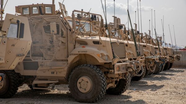 U.S. Army soldiers from the 10th Mountain Division and U.S. contractors prepare Mine Resistant Ambush Protected vehicles, MRAPs, to be transported off of base in support of the withdrawal mission in Kandahar, Afghanistan, August 21, 2020. Picture taken August 21, 2020. U.S. Army/Sgt. Jeffery J. Harris - Sputnik International