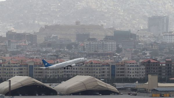 This picture taken on August 14, 2021 shows an Ariana Afghan Airlines aircraft taking-off from the airport in Kabul. This picture taken on August 14, 2021 shows an Ariana Afghan Airlines aircraft taking-off from the airport in Kabul. - Sputnik International
