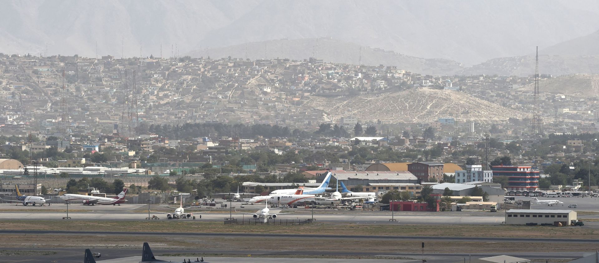 This picture taken on August 14, 2021 shows aircrafts standing on the tarmac of the airport in Kabul. - Sputnik International, 1920