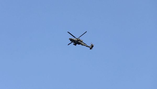 Army Apache helicopter flies over Kabul, Afghanistan August 15, 2021. REUTERS/Stringer - Sputnik International