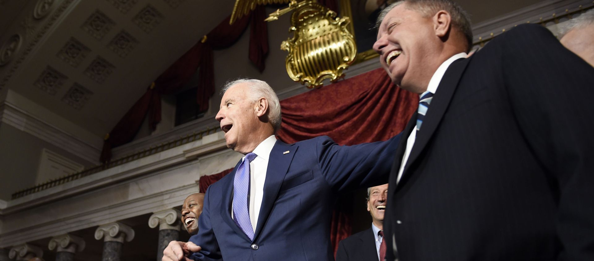 Vice President Joe Biden shares a laugh with Sen. Lindsey Graham, R-S.C., right, following a ceremonial swearing-in ceremony for Sen. Tim Scott, D-S.C., left, Tuesday, Dec. 2, 2014, in the Old Senate Chamber on Capitol Hill in Washington. Rep. Mark Sanford, R-S.C., is second from right Vice President Joe Biden shares a laugh with Sen. Lindsey Graham, R-S.C., right, following a ceremonial swearing-in ceremony for Sen. Tim Scott, D-S.C., left, Tuesday, Dec. 2, 2014, in the Old Senate Chamber on Capitol Hill in Washington. Rep. Mark Sanford, R-S.C., is second from right - Sputnik International, 1920, 16.08.2021