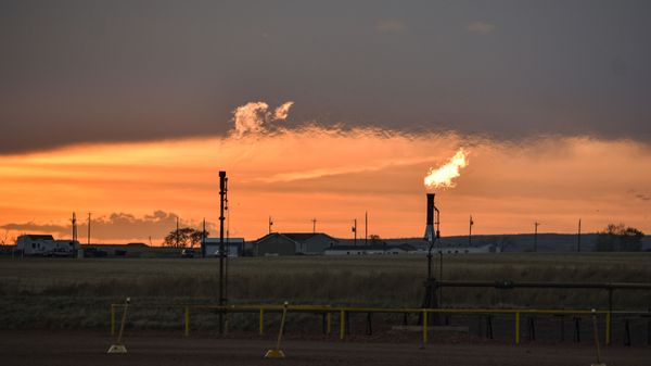 In this Tuesday, May 18, 2021, photo, flares burn natural gas from oil production in the Fort Berthold Indian Reservation east of New Town, North Dakota. - Sputnik International
