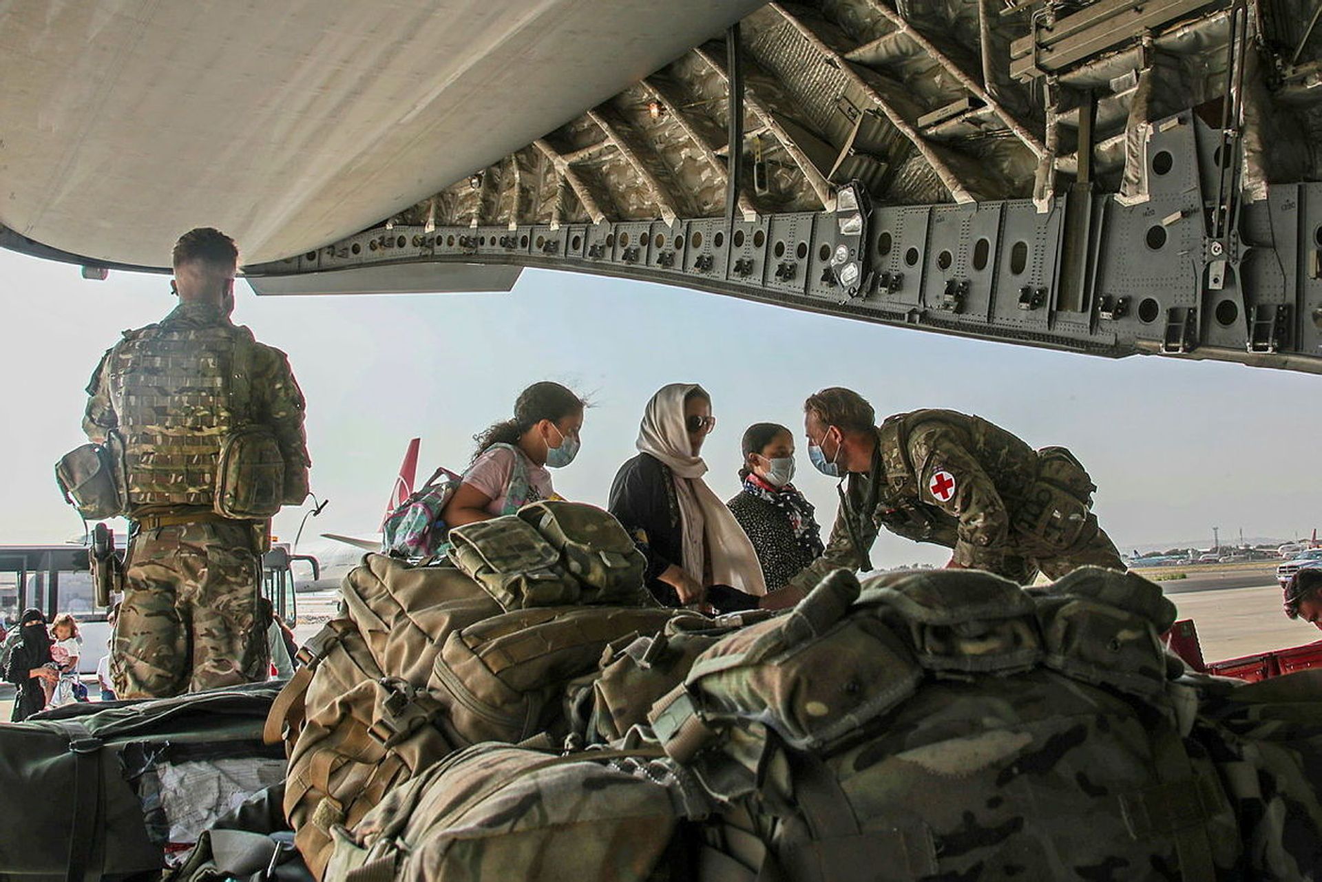 British citizens and dual nationals residing in Afghanistan board a military plane for evacuation from Kabul airport, Afghanistan August 16, 2021, in this handout picture obtained by Reuters on August 17, 2021. - Sputnik International, 1920, 07.09.2021