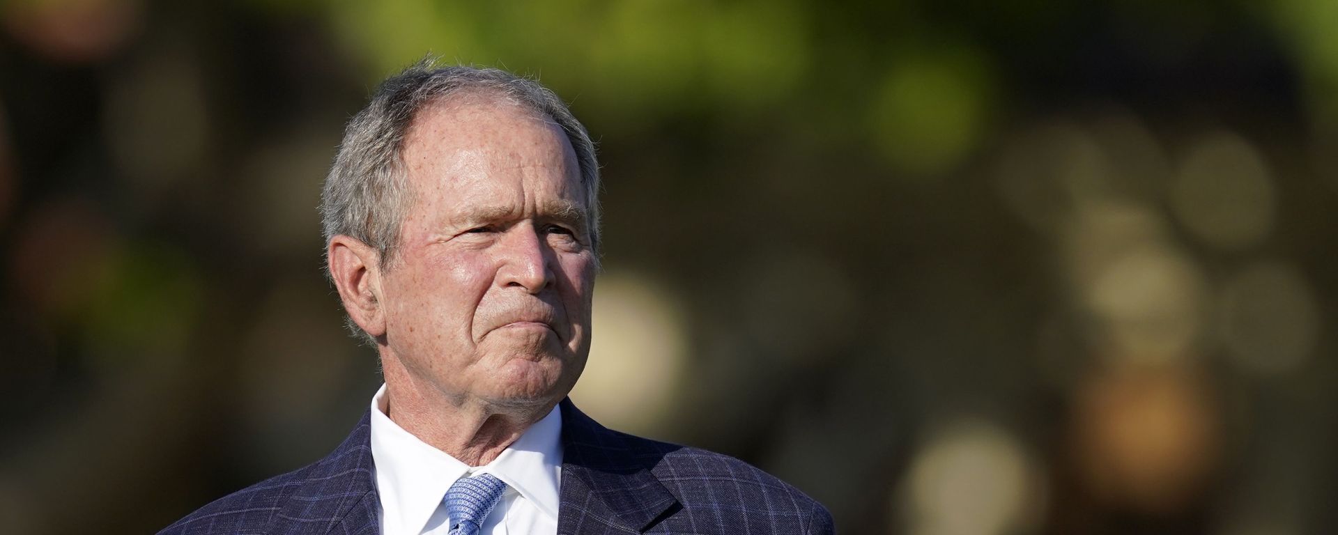 Former President George W. Bush listens to speakers during the opening ceremony of the Walker Cup golf tournament, which starts tomorrow, at Seminole Golf Club in Juno Beach, Fla., Friday, May 7, 2021. The tournament was founded by George Herbert Walker, the United States Golf Association president in 1920, who was the great-grandfather of Bush. - Sputnik International, 1920, 19.05.2022