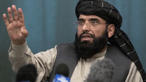 FILE - In this March 19, 2021 file photo, Suhail Shaheen, Afghan Taliban spokesman and a member of the negotiation team gestures while speaking during a joint news conference in Moscow, Russia. In an interview with The Associated Press Thursday, July 22, 2021 - Sputnik International