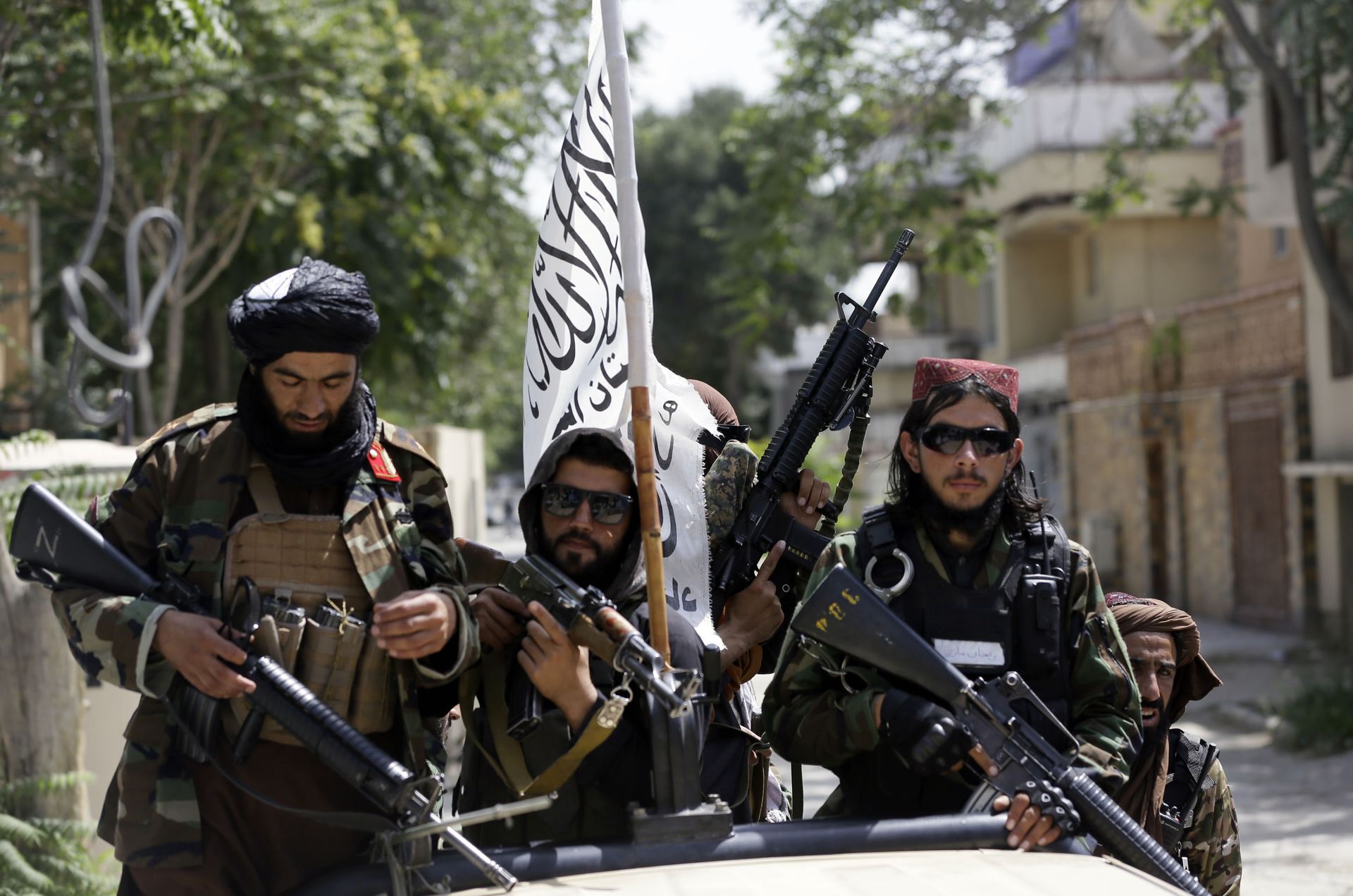 In this Aug. 19, 2021 file photo, Taliban fighters display their flag on patrol in Kabul, Afghanistan. When U.S. President Joe Biden took office early this year, Western allies were falling over themselves to welcome and praise him and hail a new era in trans-Atlantic cooperation. - Sputnik International, 1920, 07.09.2021