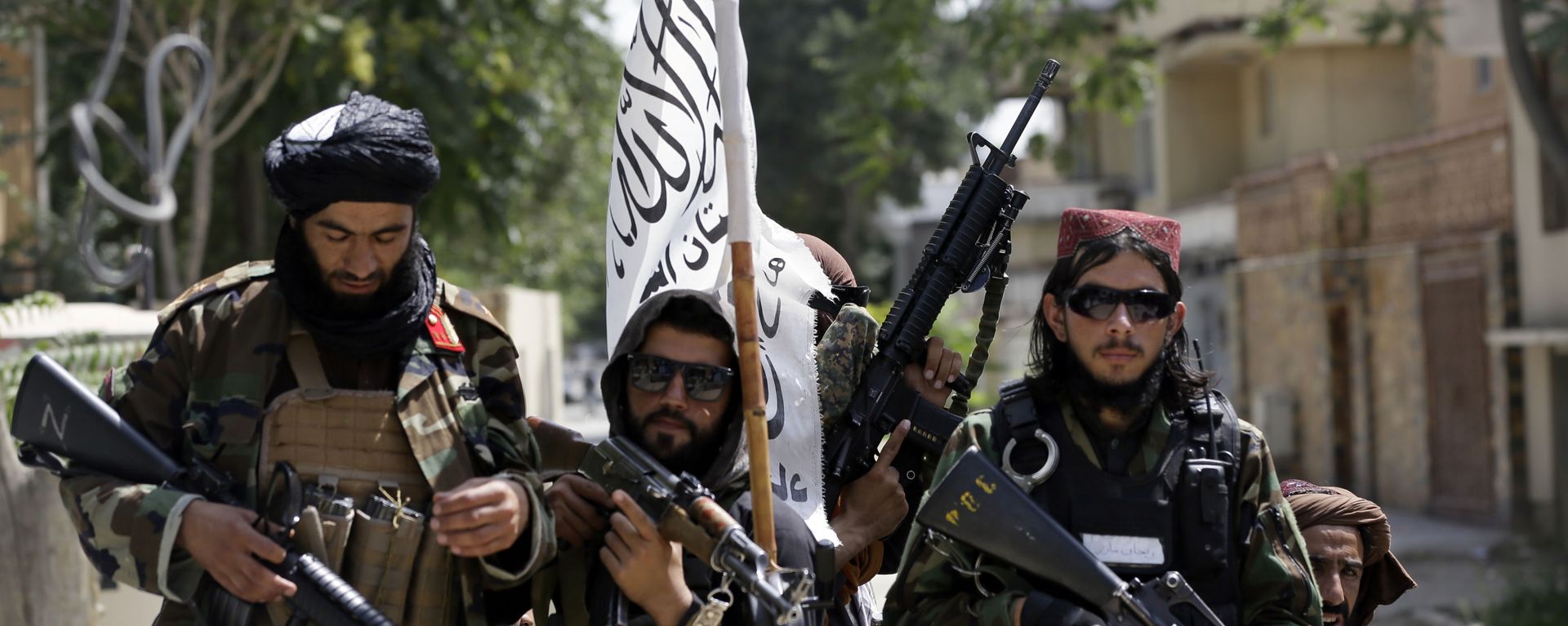 In this Aug. 19, 2021 file photo, Taliban fighters display their flag on patrol in Kabul, Afghanistan. When U.S. President Joe Biden took office early this year, Western allies were falling over themselves to welcome and praise him and hail a new era in trans-Atlantic cooperation. In this Aug. 19, 2021 file photo, Taliban fighters display their flag on patrol in Kabul, Afghanistan. When U.S. President Joe Biden took office early this year, Western allies were falling over themselves to welcome and praise him and hail a new era in trans-Atlantic cooperation. - Sputnik International, 1920, 25.08.2021