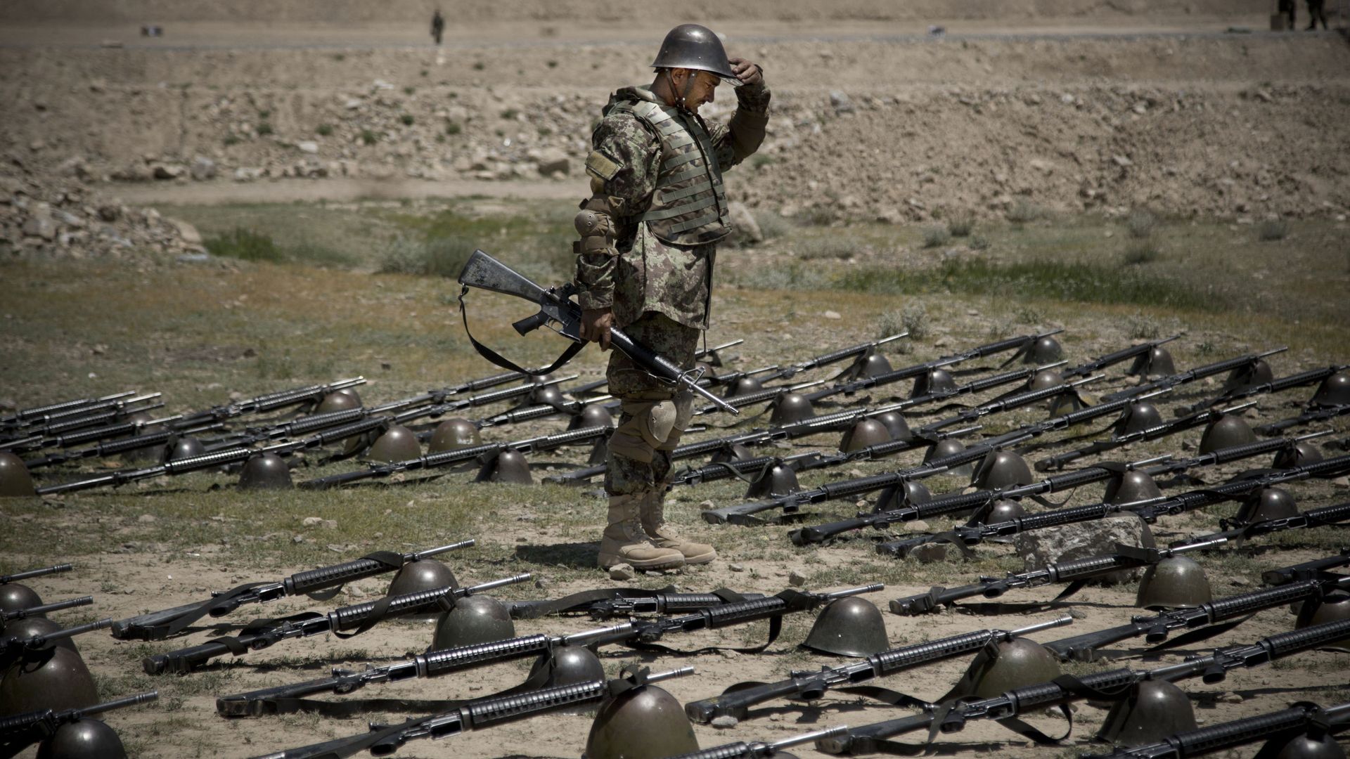 An Afghan Army soldier pauses before dropping his helmet and his gun next to his comrade's equipment at a training facility in the outskirts of Kabul, Afghanistan on Wednesday, May 8, 2013. An Afghan Army soldier pauses before dropping his helmet and his gun next to his comrade's equipment at a training facility in the outskirts of Kabul, Afghanistan on Wednesday, May 8, 2013. - Sputnik International, 1920, 20.08.2021