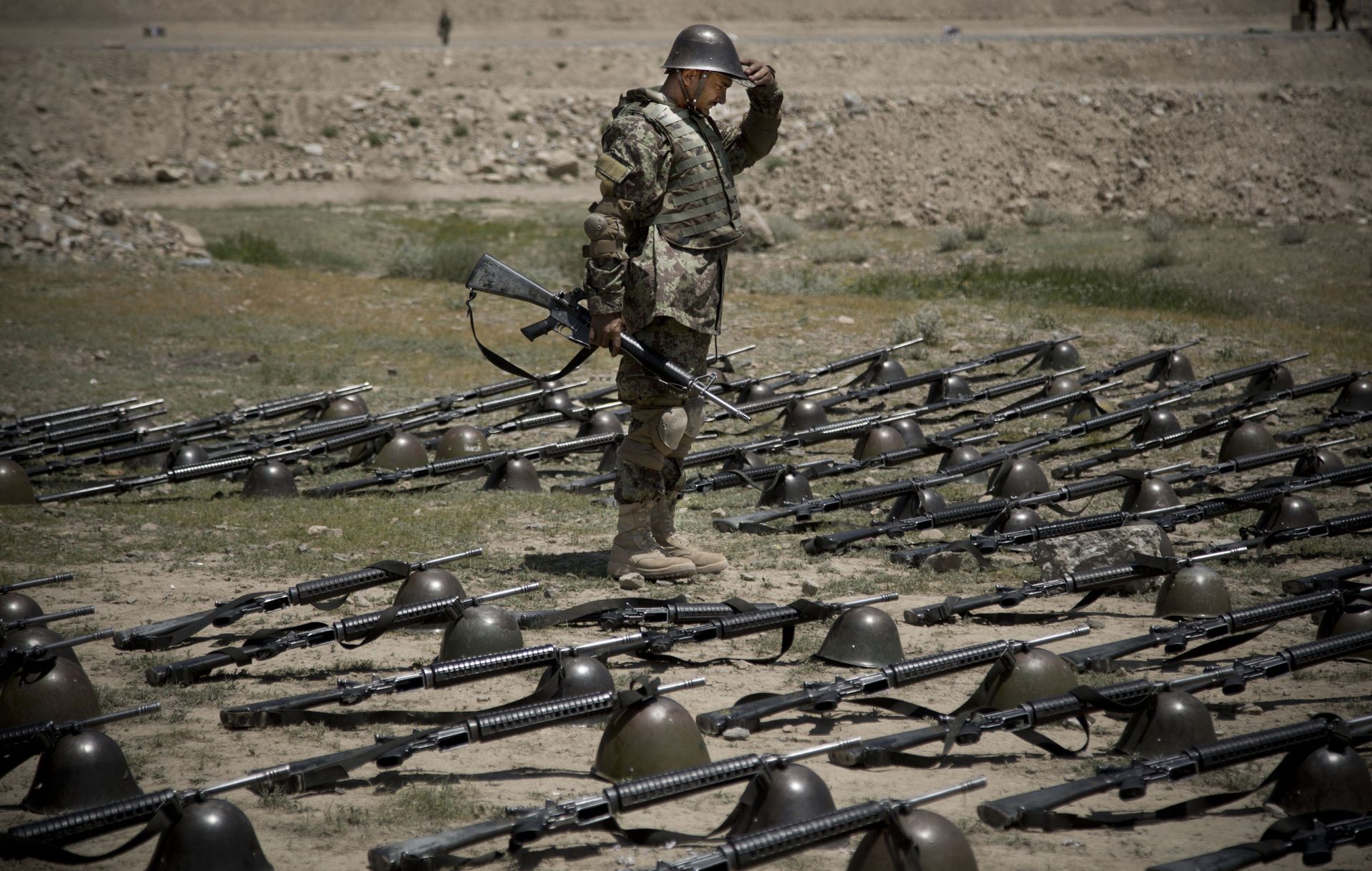 An Afghan Army soldier pauses before dropping his helmet and his gun next to his comrade's equipment at a training facility in the outskirts of Kabul, Afghanistan on Wednesday, May 8, 2013. An Afghan Army soldier pauses before dropping his helmet and his gun next to his comrade's equipment at a training facility in the outskirts of Kabul, Afghanistan on Wednesday, May 8, 2013. - Sputnik International, 1920, 07.09.2021