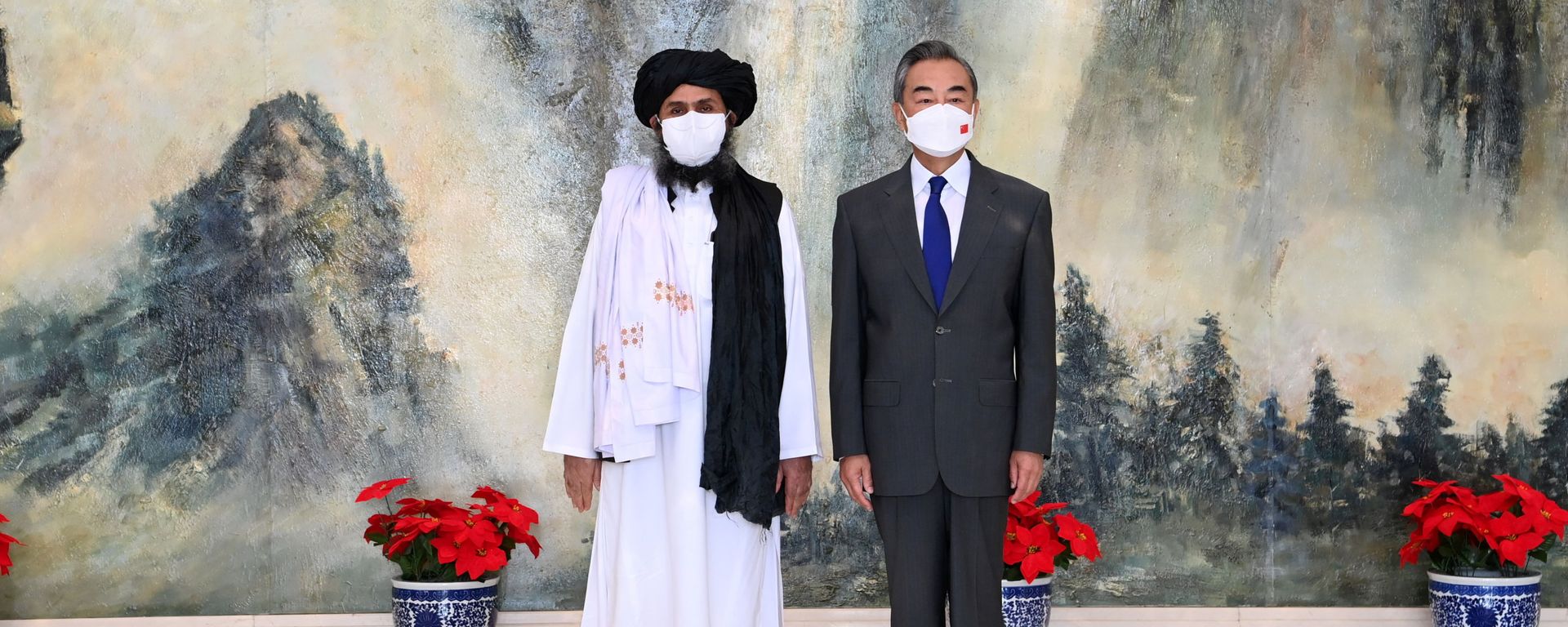 Chinese State Councilor and Foreign Minister Wang Yi meets with Mullah Abdul Ghani Baradar, political chief of Afghanistan's Taliban, in Tianjin, China July 28, 2021. Picture taken July 28, 2021. Chinese State Councilor and Foreign Minister Wang Yi meets with Mullah Abdul Ghani Baradar, political chief of Afghanistan's Taliban, in Tianjin, China July 28, 2021. Picture taken July 28, 2021. - Sputnik International, 1920, 30.08.2021