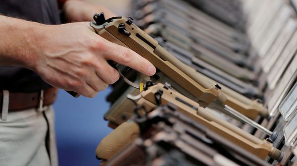 FILE PHOTO: A man inspects a handgun inside of the Beretta booth during the National Rifle Association (NRA) annual meeting in Indianapolis, Indiana - Sputnik International