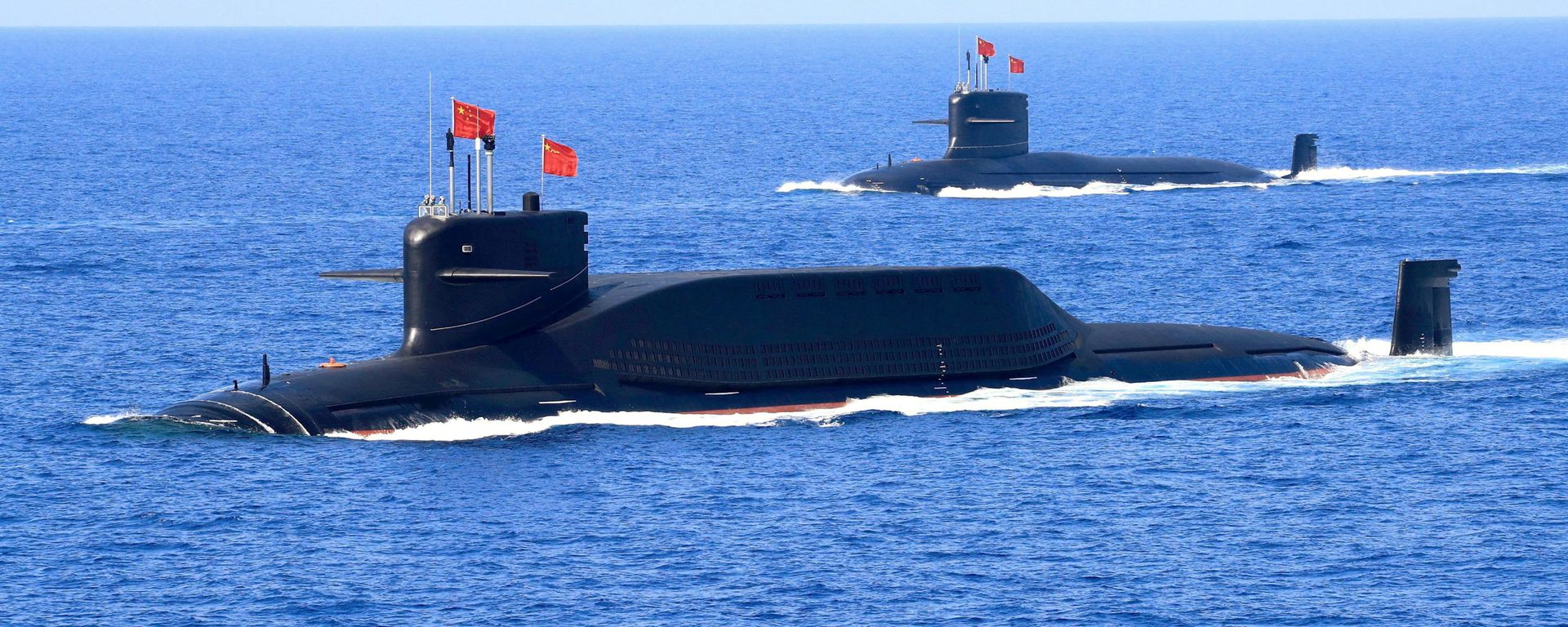 A nuclear-powered Type 094A Jin-class ballistic missile submarine of the Chinese People's Liberation Army (PLA) Navy is seen during a military display in the South China Sea April 12, 2018 A nuclear-powered Type 094A Jin-class ballistic missile submarine of the Chinese People's Liberation Army (PLA) Navy is seen during a military display in the South China Sea April 12, 2018 - Sputnik International, 1920, 18.09.2021