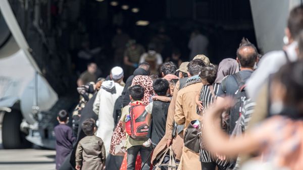 Families board a U.S. Air Force Boeing C-17 Globemaster III during an evacuation at Hamid Karzai International Airport in Kabul, Afghanistan, August 24, 2021 - Sputnik International