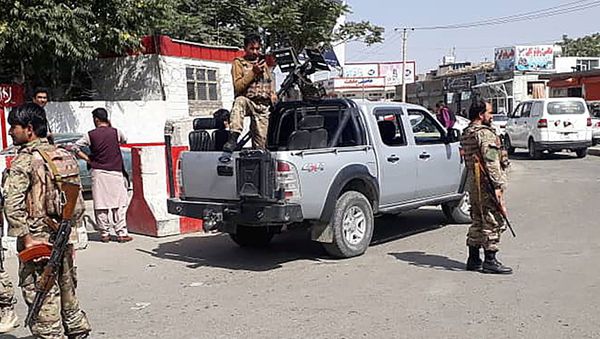 Afghan security forces stand guard at the entrance gate of Hamid Karzai International Airport in Kabul, Afghanistan August 15, 2021.  - Sputnik International