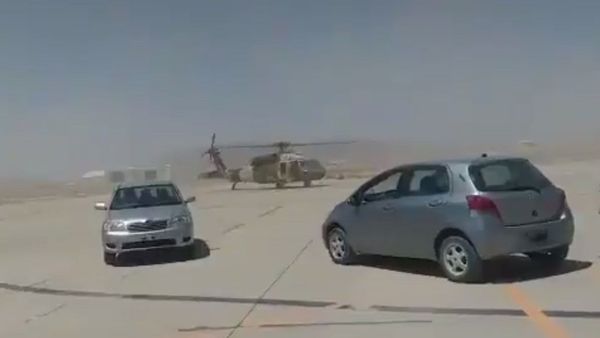Screenshot captures the moment in which a US-supplied Black Hawk chopper is seen being manned by Taliban forces. The costly aircraft is seen never flying by taxiing the tarmac. - Sputnik International