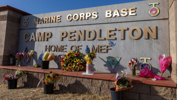 Following the bombing at Hamid Karzai International Airport in Kabul, Afghanistan, flowers are shown placed at the main gate to U.S. Marine Base Camp Pendleton in Oceanside, California, U.S., August 27, 2021. - Sputnik International