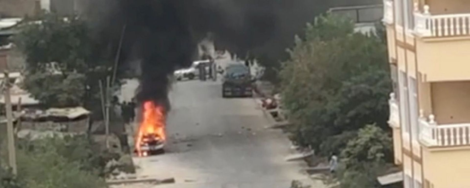 A view of remnants of flames from cars where rockets towards Kabul's international airport were fired from but were intercepted by a missile defense system, in Kabul, Afghanistan, August 30, 2021 in this still image taken from video provided on social media A view of remnants of flames from cars where rockets towards Kabul's international airport were fired from but were intercepted by a missile defense system, in Kabul, Afghanistan, August 30, 2021 in this still image taken from video provided on social media - Sputnik International, 1920, 30.08.2021