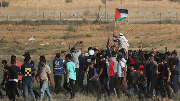 Palestinian demonstrators gather at the Israel-Gaza border fence during a protest in the southern Gaza Strip August 25, 2021 - Sputnik International
