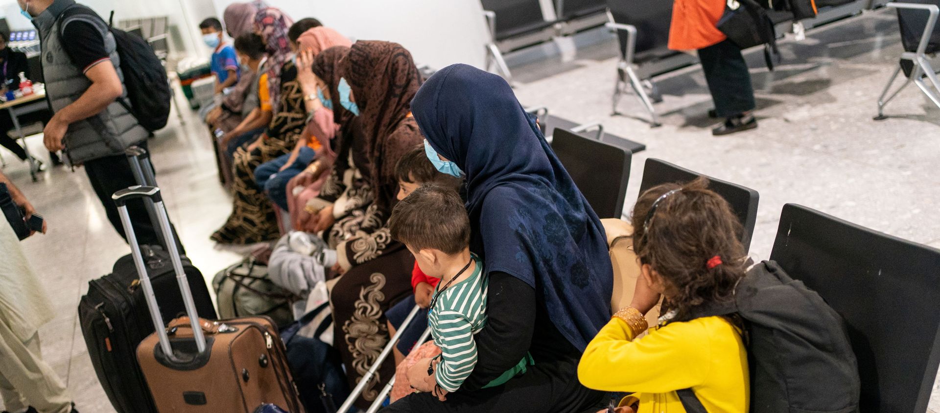 Refugees from Afghanistan wait to be processed after arriving on an evacuation flight at Heathrow Airport, in London, Britain August 26, 2021 Refugees from Afghanistan wait to be processed after arriving on an evacuation flight at Heathrow Airport, in London, Britain August 26, 2021 - Sputnik International, 1920