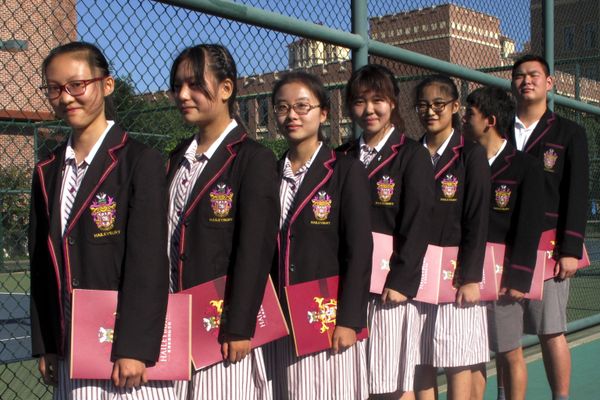 Chinese students prepare for the opening ceremony of the Haileybury College Chinese campus in China's northern Tianjin Municipality. International schools are booming thanks to growing demand from Chinese parents seeking different pathways for their children to study abroad. Top prep schools are opening campuses in China and catering to students who want to go to university in the West. Getting into China’s best public high schools can be monumentally difficult and many parents are opting to pay for what they see as a less stressful and more enriching experience at an international school. - Sputnik International