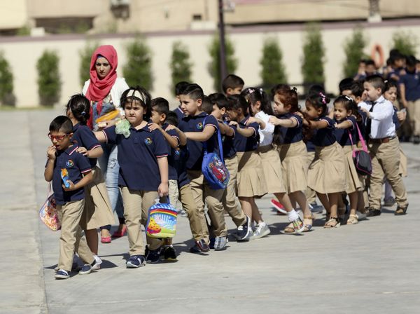 Students line up to enter a classroom in their new uniforms on the first day of classes in Baghdad, Iraq, Thursday, 29 September 2016.  - Sputnik International