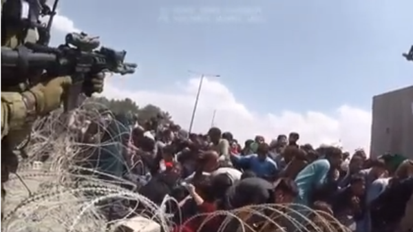 Screengrab of US Marine Michael Markland's viral video showing the chaos at Kabul's airport in the final days of the US presence there. - Sputnik International
