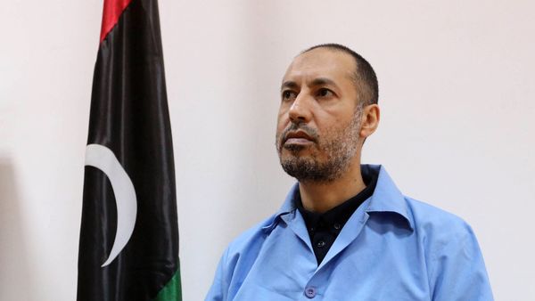 Saadi Kadhafi, the son of slain Libyan dictator Moamer Kadhafi, sits dressed in prison blues waiting before trial in a courthouse in the Libyan capital Tripoli on March 13, 2016 - Sputnik International