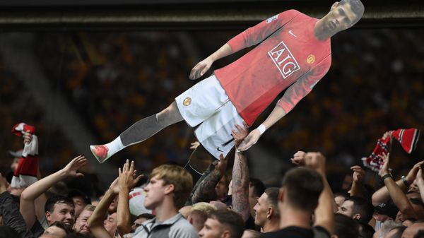 Soccer Football - Premier League - Wolverhampton Wanderers v Manchester United - Molineux Stadium, Wolverhampton, Britain - August 29, 2021 General view of Manchester United fans holding up a cardboard cut out of Cristiano Ronaldo - Sputnik International