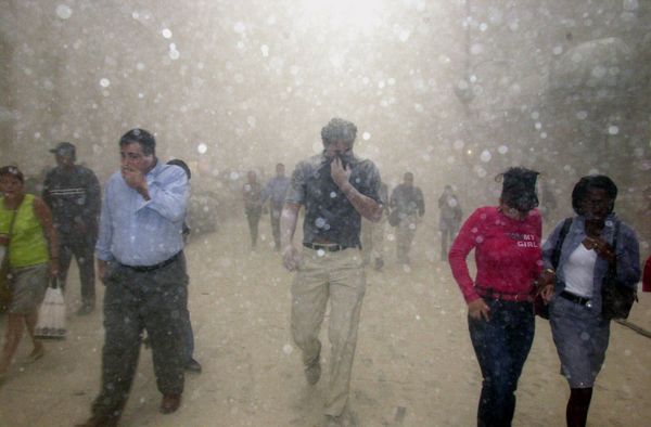 People run from the collapse of the World Trade Center towers in New York, on Tuesday, 11 September 2001 after terrorists flew two hijacked airplanes into the North and South towers. - Sputnik International