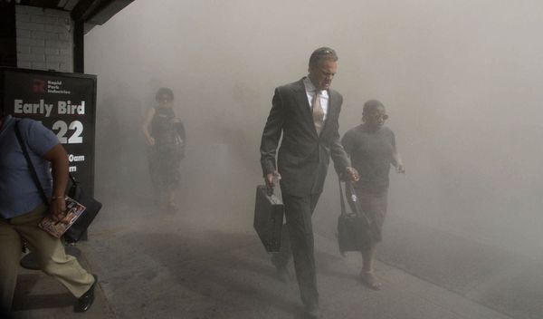 Pedestrians on Beekman St. flee the area of the collapsed World Trade Center in lower Manhattan following a terrorist attack on the New York landmark on Tuesday, 11 September 2001. - Sputnik International