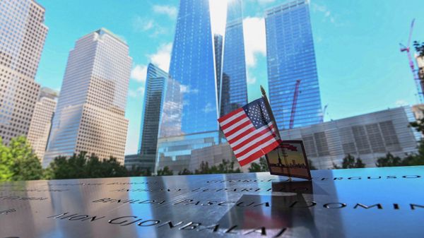A US flag adorns a metal apron at the National 9/11 Memorial & Museum on September 10, 2021, that is inscribed with names of people who died on the September 11, 2001 terrorist attacks in the city. - Sputnik International