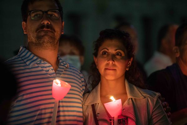 A couple holds candles as they attend a religious 9/11 commemoration ceremony at the Greek Orthodox St. Nicholas National Shrine adjacent to the 9/11 Memorial & Museum in New York City on 10 September 2021. A couple holds candles as they attend a religious 9/11 commemoration ceremony at the Greek Orthodox St. Nicholas National Shrine adjacent to the 9/11 Memorial & Museum in New York City on 10 September 2021. - Sputnik International