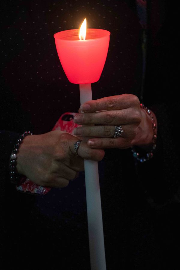 A woman holds a lit candle during a religious 9/11 commemoration ceremony at the Greek Orthodox St. Nicholas National Shrine adjacent to the 9/11 Memorial & Museum in New York City on 10 September 2021. A woman holds a lit candle during a religious 9/11 commemoration ceremony at the Greek Orthodox St. Nicholas National Shrine adjacent to the 9/11 Memorial & Museum in New York City on 10 September 2021. - Sputnik International