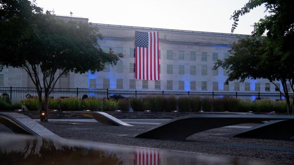 An American flag hangs from the side of the Pentagon to commemorate the 20th anniversary of the 9/11 attacks,as seen from the Pentagon 9/11 Memorial on September 11, 2021, in Washington,DC. An American flag hangs from the side of the Pentagon to commemorate the 20th anniversary of the 9/11 attacks,as seen from the Pentagon 9/11 Memorial on September 11, 2021, in Washington,DC. - Sputnik International