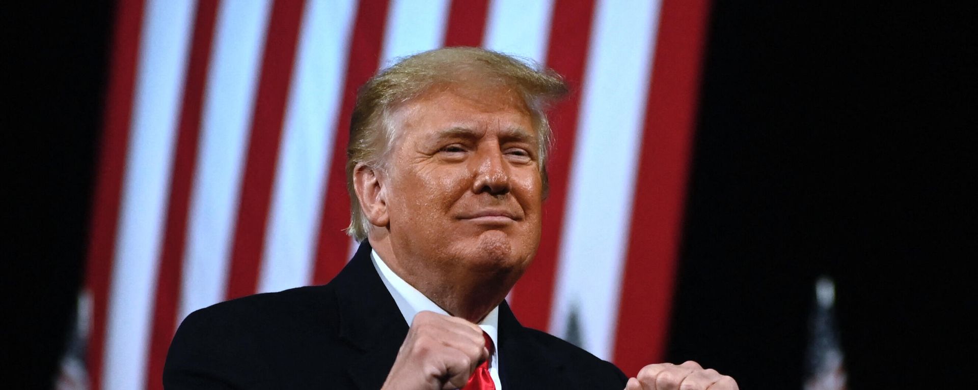 In this file photo taken on December 05, 2020 US President Donald Trump holds up his fists at the end of a rally to support Republican Senate candidates at Valdosta Regional Airport in Valdosta, Georgia. In this file photo taken on December 05, 2020 US President Donald Trump holds up his fists at the end of a rally to support Republican Senate candidates at Valdosta Regional Airport in Valdosta, Georgia. - Sputnik International, 1920, 01.10.2021