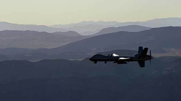 This handout photo courtesy of the US Air Force obtained on November 7, 2020 shows an armed MQ-9 Reaper unmanned aerial vehicle (UAV or drone) as it flies over the Nevada Test and Training Range on July 15, 2019. - Sputnik International