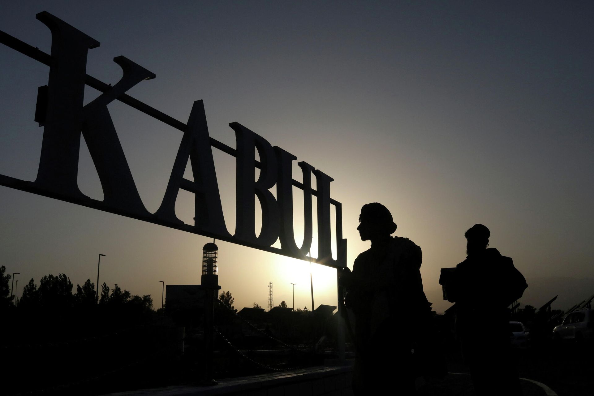 Taliban soldiers stand in front of a sign at the international airport in Kabul, Afghanistan, September 9, 2021 Taliban soldiers stand in front of a sign at the international airport in Kabul, Afghanistan, September 9, 2021 - Sputnik International, 1920, 29.09.2021