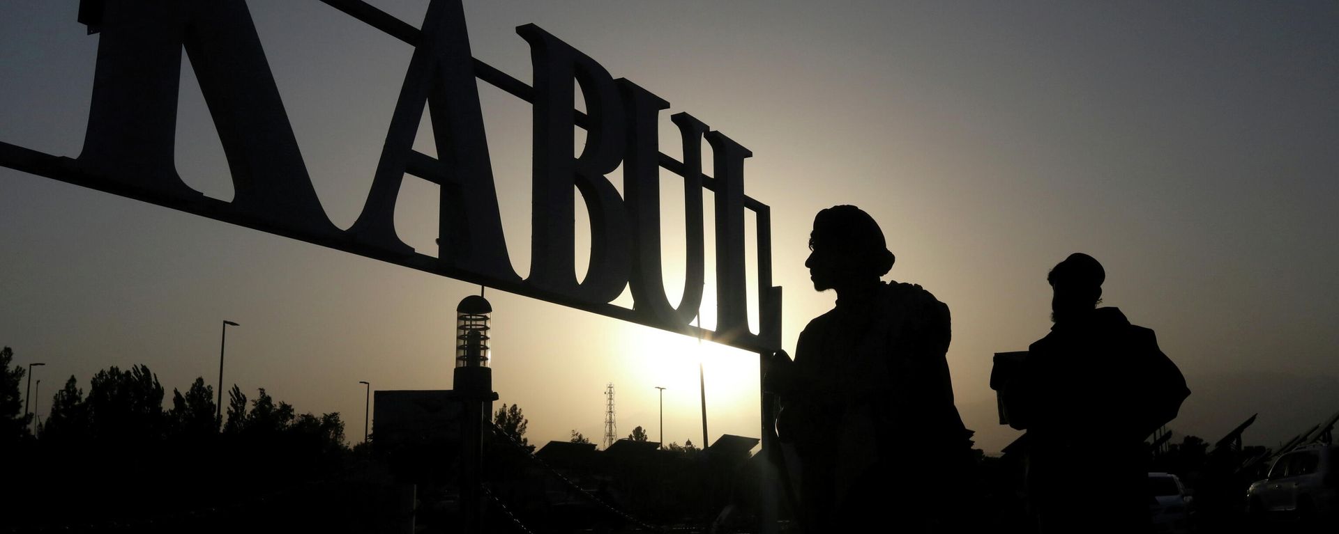 Taliban soldiers stand in front of a sign at the international airport in Kabul, Afghanistan, September 9, 2021 Taliban soldiers stand in front of a sign at the international airport in Kabul, Afghanistan, September 9, 2021 - Sputnik International, 1920, 16.09.2021
