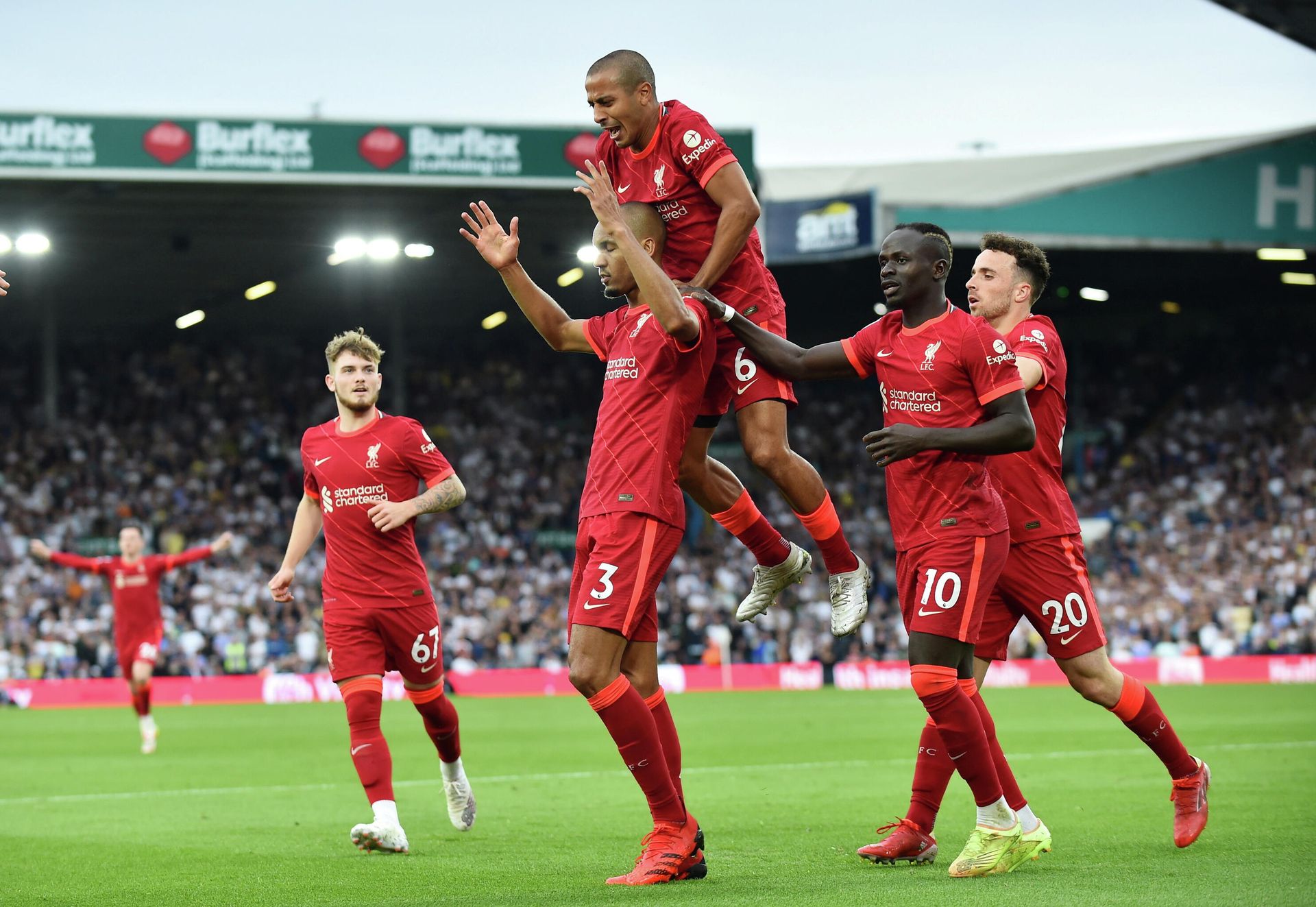Soccer Football - Premier League - Leeds United v Liverpool - Elland Road, Leeds, Britain - September 12, 2021 Liverpool's Fabinho celebrates scoring their second goal with Thiago Alcantara and teammates. Soccer Football - Premier League - Leeds United v Liverpool - Elland Road, Leeds, Britain - September 12, 2021 Liverpool's Fabinho celebrates scoring their second goal with Thiago Alcantara and teammates. - Sputnik International, 1920, 14.09.2021