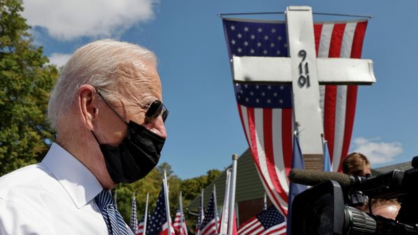U.S. President Joe Biden speaks to reporters before paying his respects at a 9/11 memorial outside the Shanksville volunteer fire station, as he and first lady Jill Biden stopped at the fire hall after visiting the nearby site where the hijacked United Airlines Flight 93 plane crashed, on the 20th anniversary of the September 11, 2001 attacks, in Shanksville, Pennsylvania, U.S., September 11, 2021. Biden has repeatedly visited the firehouse over the years since 2001. - Sputnik International