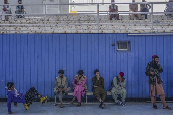 A youth (L) warms up before showing his skills during an event organised for the visit of the Taliban's director of physical education and sports, Bashir Ahmad Rustamzai (not pictured), at a gymnasium in Kabul on 14 September 2021. - Sputnik International