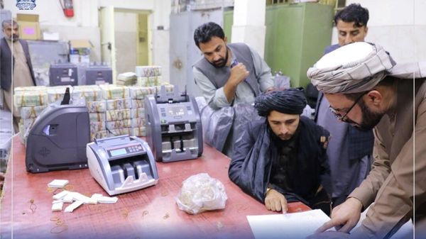 Men are pictured as Afghanistan's Taliban-controlled central bank seizes a large amount of money in cash and gold from former top government officials, including former vice president Amrullah Saleh, in Afghanistan, in this handout obtained by Reuters on September 15, 2021 - Sputnik International