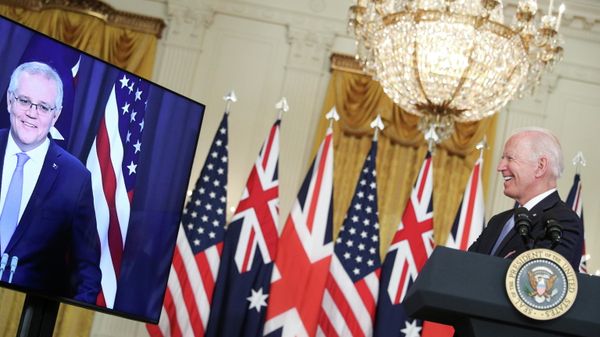 U.S. President Joe Biden smiles while delivering remarks on a National Security Initiative virtually with Australian Prime Minister Scott Morrison and British Prime Minister Boris Johnson (not pictured) inside the East Room at the White House in Washington, U.S., September 15, 2021 - Sputnik International