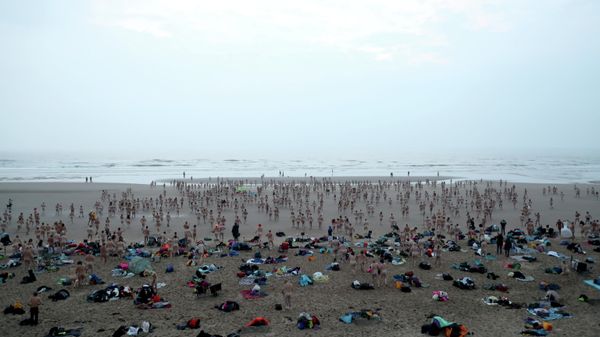 SENSITIVE MATERIAL. THIS IMAGE MAY OFFEND OR DISTURB Participants in the annual North East Skinny Dip walk the beach in Druridge Bay, Britain, September 19, 2021. REUTERS/Scott Heppell SENSITIVE MATERIAL. THIS IMAGE MAY OFFEND OR DISTURB Participants in the annual North East Skinny Dip walk the beach in Druridge Bay, Britain, September 19, 2021. REUTERS/Scott Heppell - Sputnik International