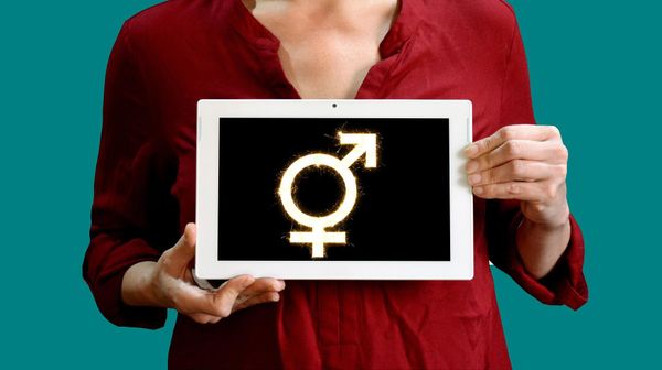 A woman holding a sign  - Sputnik International