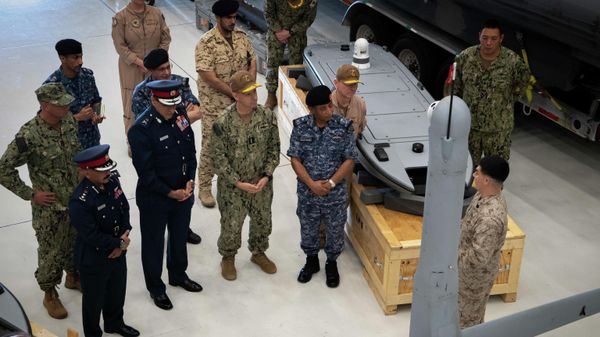 NAVAL SUPPORT ACTIVITY BAHRAIN (Sept. 23, 2021) Vice Adm. Brad Cooper, commander of U.S. Naval Forces Central Command (NAVCENT), U.S. 5th Fleet, and Combined Maritime Forces, center right, along with Major Gen. Ala Abdulla Seyadi, commander of the Bahrain Coast Guard, center left; and Rear Adm - Sputnik International