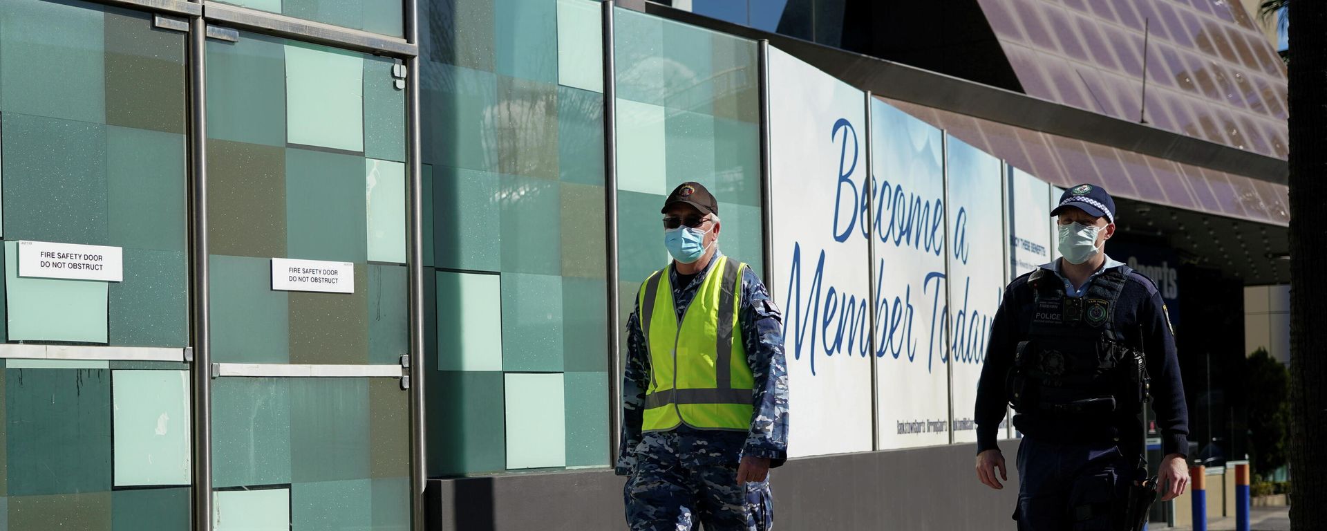 Personnel from the Australian Defence Force and New South Wales Police Force patrol a street in the Bankstown suburb during an outbreak of the coronavirus disease (COVID-19) in Sydney, Australia, August 3, 2021 Personnel from the Australian Defence Force and New South Wales Police Force patrol a street in the Bankstown suburb during an outbreak of the coronavirus disease (COVID-19) in Sydney, Australia, August 3, 2021 - Sputnik International, 1920, 27.09.2021