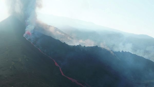 A screengrab from a drone footage shows lava flowing following the eruption of a volcano in the Cumbre Vieja park, on the Canary Island of La Palma, Spain September 26, 2021. Footage obtained on September 26, 2021 - Sputnik International