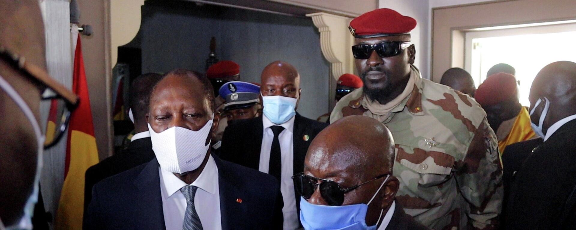 Ghana's President Nana Akufo-Addo speaks to members of the media as Ivory Coast's President Alassane Ouattara, and Guinea's Special forces commander Mamady Doumbouya, who ousted President Alpha Conde, stand next to him after their meeting to discuss ways to return Guinea to constitutional order, in Conakry, Guinea, September 17, 2021. Ghana's President Nana Akufo-Addo speaks to members of the media as Ivory Coast's President Alassane Ouattara, and Guinea's Special forces commander Mamady Doumbouya, who ousted President Alpha Conde, stand next to him after their meeting to discuss ways to return Guinea to constitutional order, in Conakry, Guinea, September 17, 2021. - Sputnik International, 1920, 27.09.2021